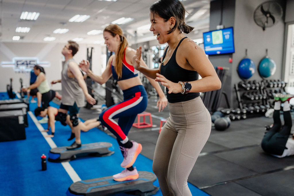 Beginner working out with a coach at F45